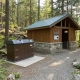 TuffBoxx commercial container installed outside Canadian park washroom facility with Bear Aware signage showing wildlife-resistant waste management for municipal park operations